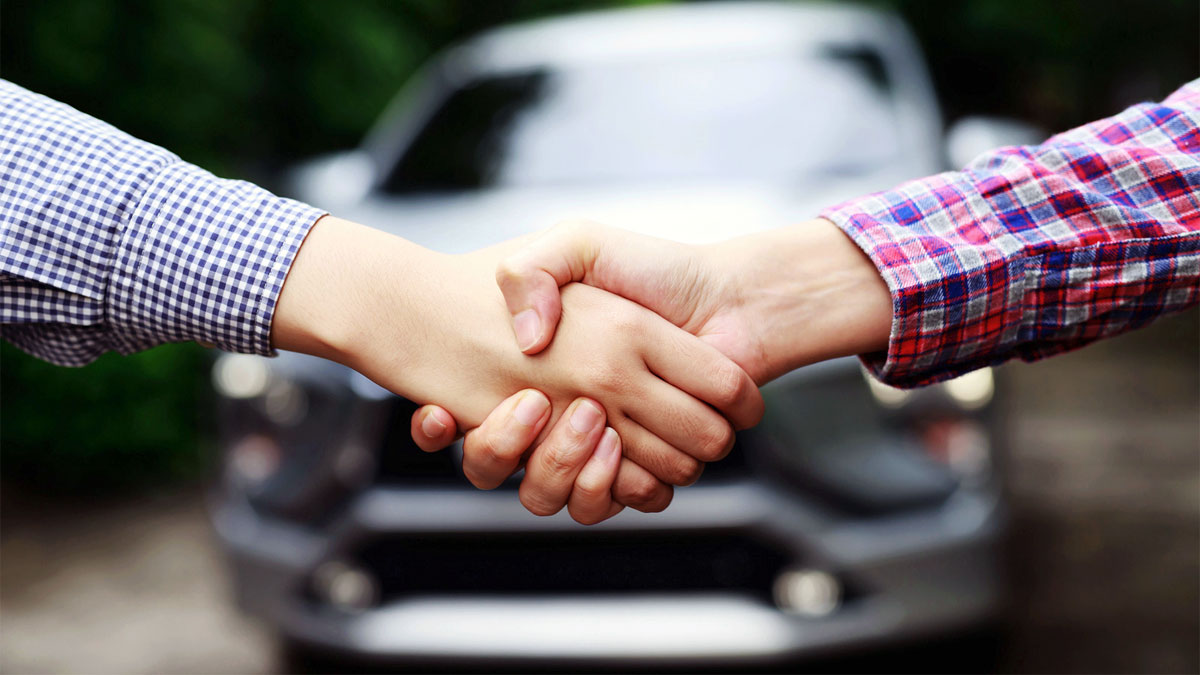 buying used car handshake